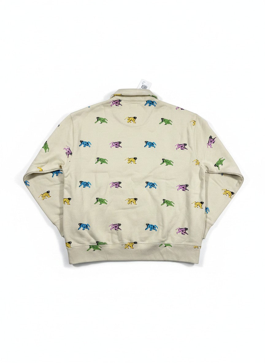 Throwback Rack Levi's x Creative Growth beige 1/4 zip sweatshirt with all-over colorful monkey print. Long sleeves, collared neck.