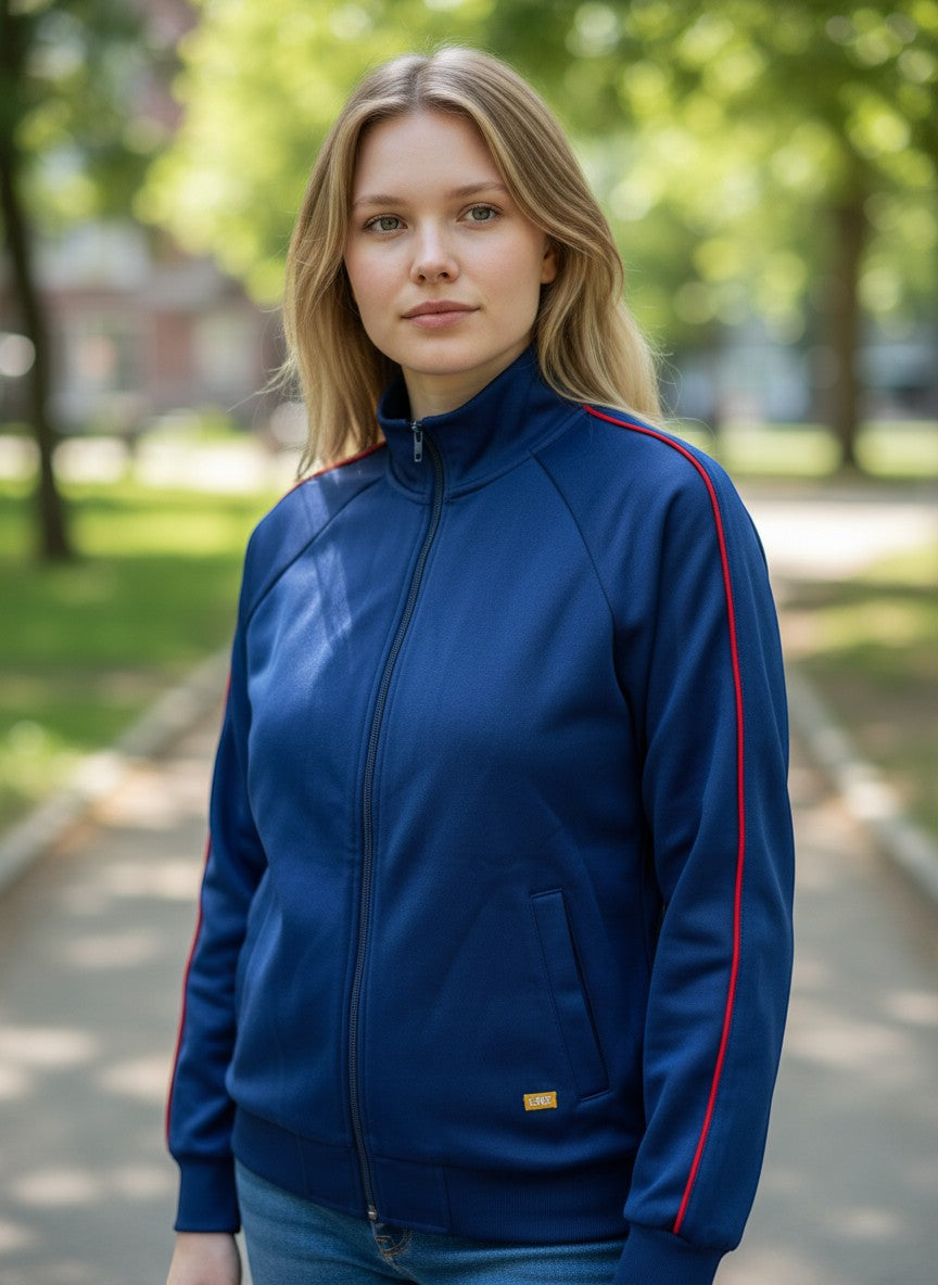 Throwback Rack Levi’s Gold Tab Off Court Blue Track Jacket with red trim on sleeves and collar. Model wears jeans.