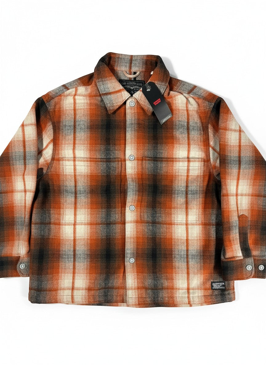 Throwback Rack Levi’s Plaid Wool Portola Jacket in orange, cream, and black plaid. Features button-up front and chest pockets.
